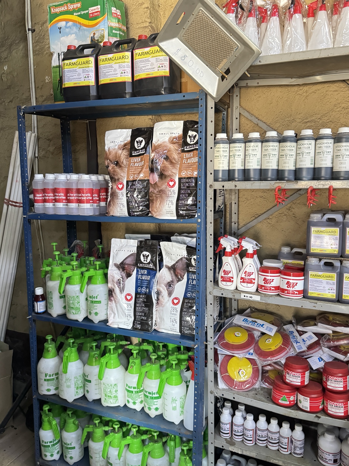 Emperor dog food packs displayed on retail shelves with animal-care supplies